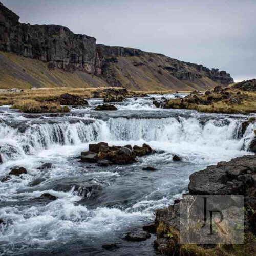 River landscape with rapids and rocky banks